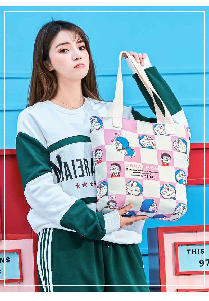 商品[国内直发] GLENVINTEN|哆啦A梦正版授权女包日系帆布包斜挎包学生单肩ins小包卡通女包,价格¥178,第4张图片详细描述