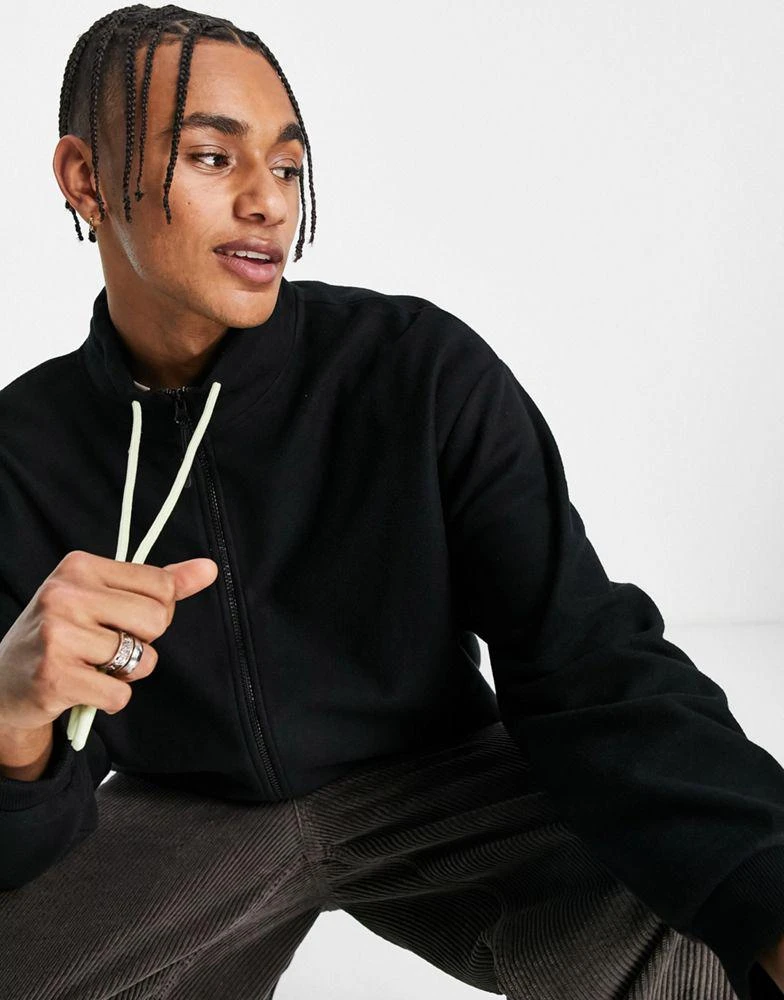 商品ASOS|ASOS Unrvlld Spply oversized zip through fleece jacket with large logo back print in black,价格¥195,第2张图片详细描述