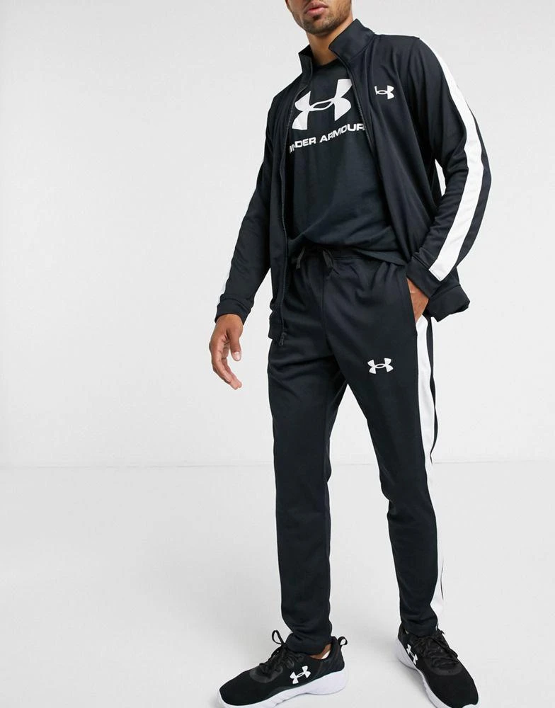 商品Under Armour|Under Armour tracksuit set in black with white stripe,价格¥307,第4张图片详细描述