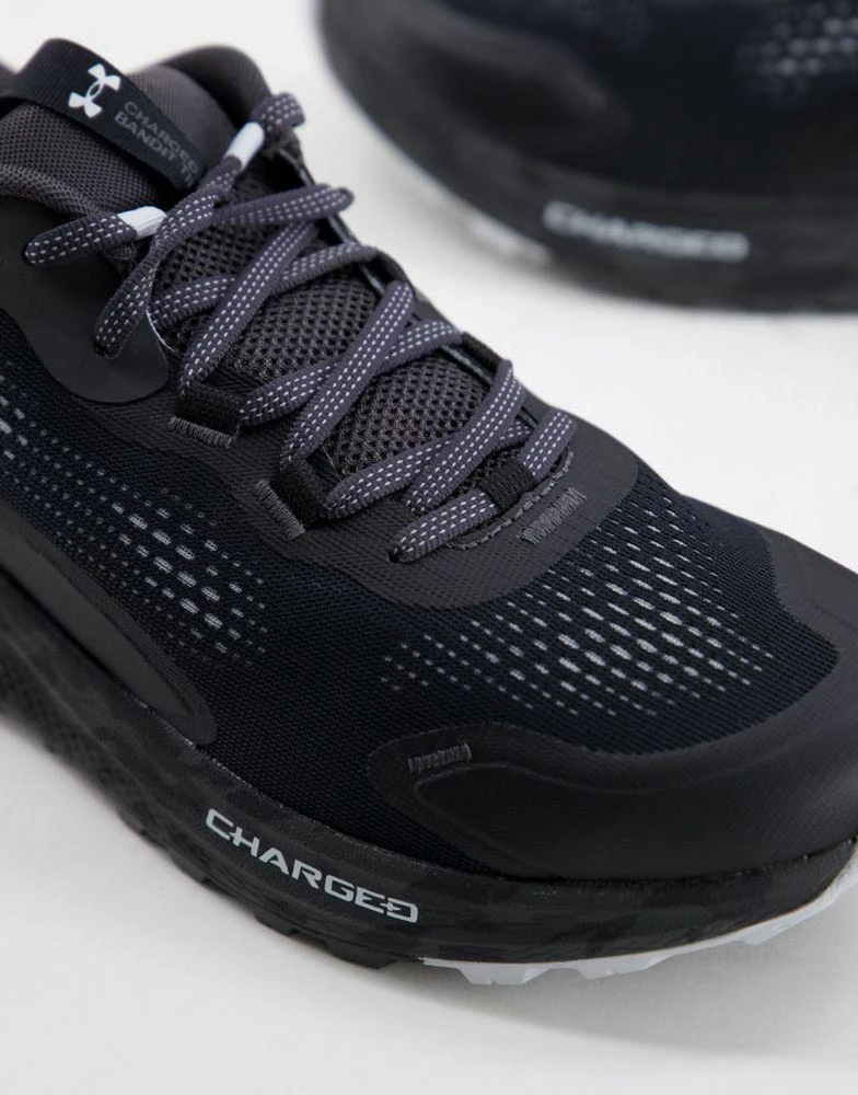商品Under Armour|Under Armour Running Charged Bandit TR 2 trainers in black with camo sole,价格¥704,第4张图片详细描述
