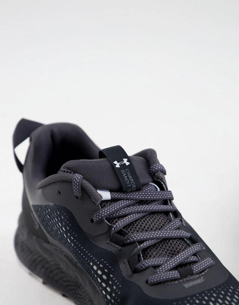 商品Under Armour|Under Armour Running Charged Bandit TR 2 trainers in black with camo sole,价格¥704,第3张图片详细描述