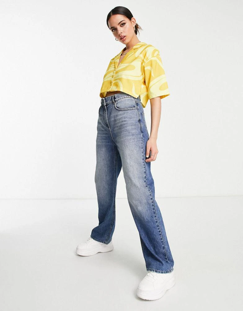 商品Fila|Fila swirl print cropped shirt in yellow,价格¥152,第4张图片详细描述