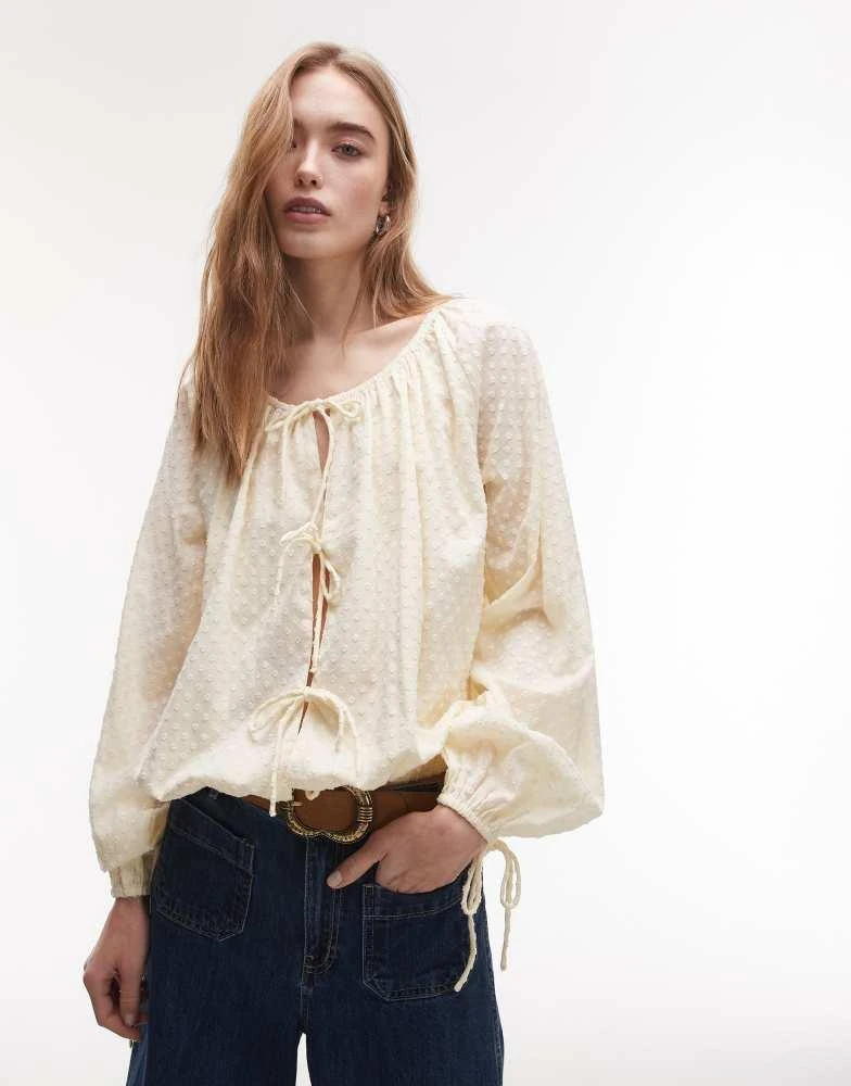 商品Topshop|Topshop dobby ruched neck tie front top in buttermilk,价格¥93,第1张图片