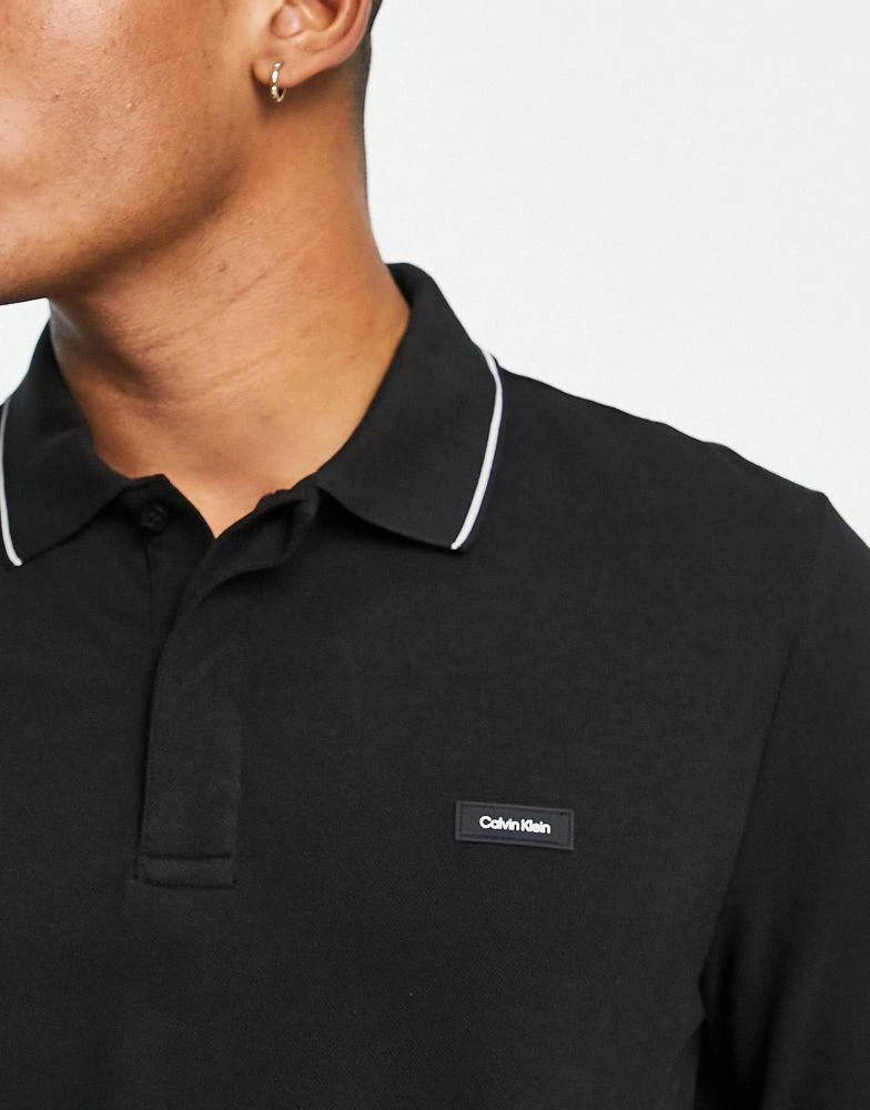 商品Calvin Klein|Calvin Klein logo tipped stretch pique cotton blend long sleeve polo in black,价格¥653,第3张图片详细描述