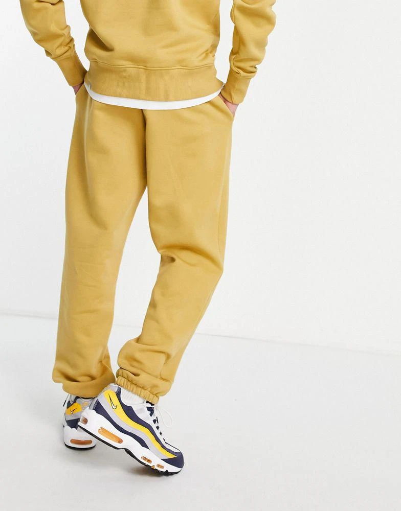 商品The North Face|The North Face oversized essential joggers in yellow Exclusive at ASOS,价格¥346,第2张图片详细描述