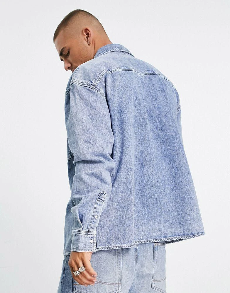 商品Calvin Klein|Calvin Klein Jeans oversized denim shirt in light wash,价格¥814,第2张图片详细描述