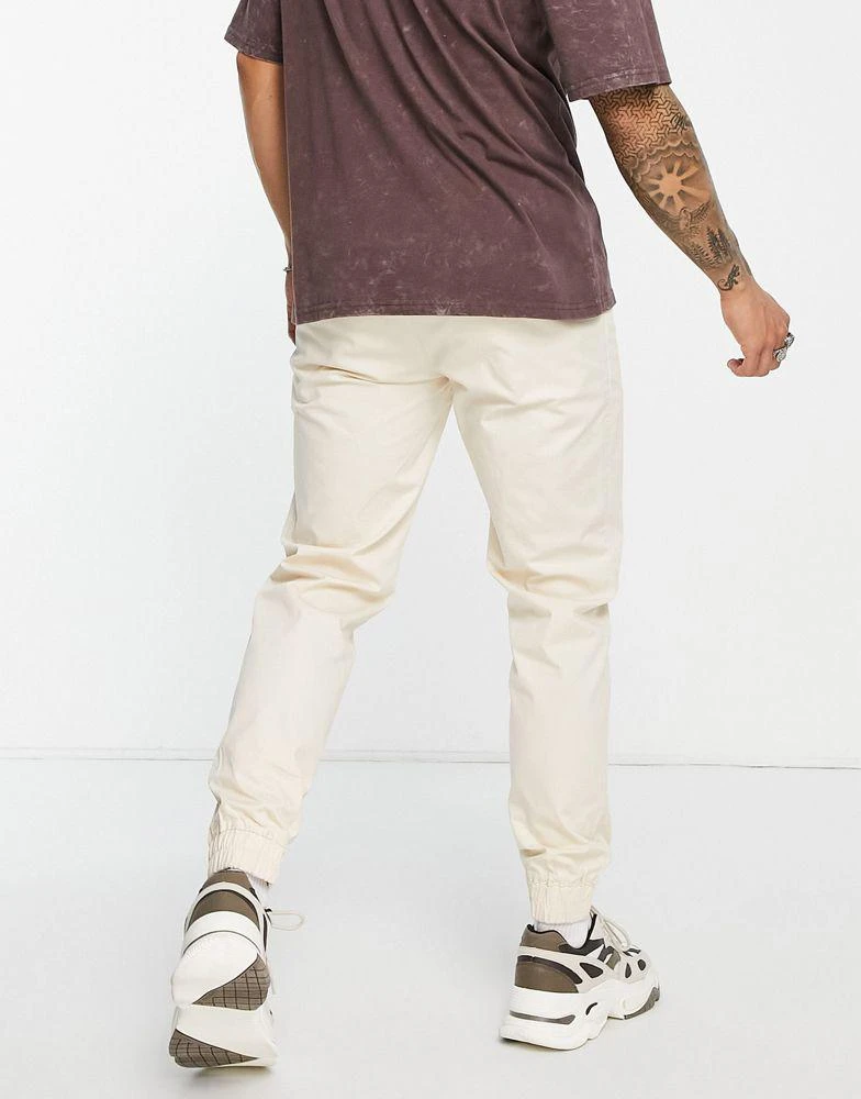 商品CHAMPION|Champion oversized jogger with small logo in tan,价格¥237,第2张图片详细描述