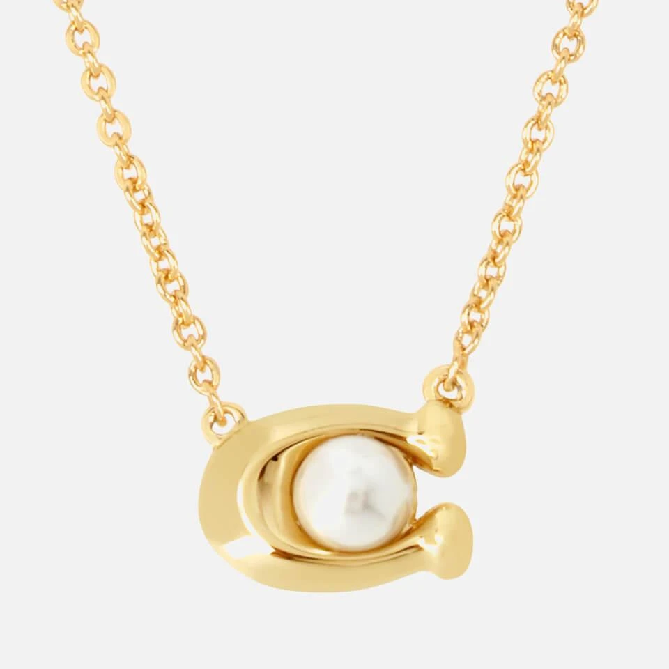 商品Coach|Coach Pearl Signature Gold-Tone Pendant Necklace,价格¥684,第2张图片详细描述