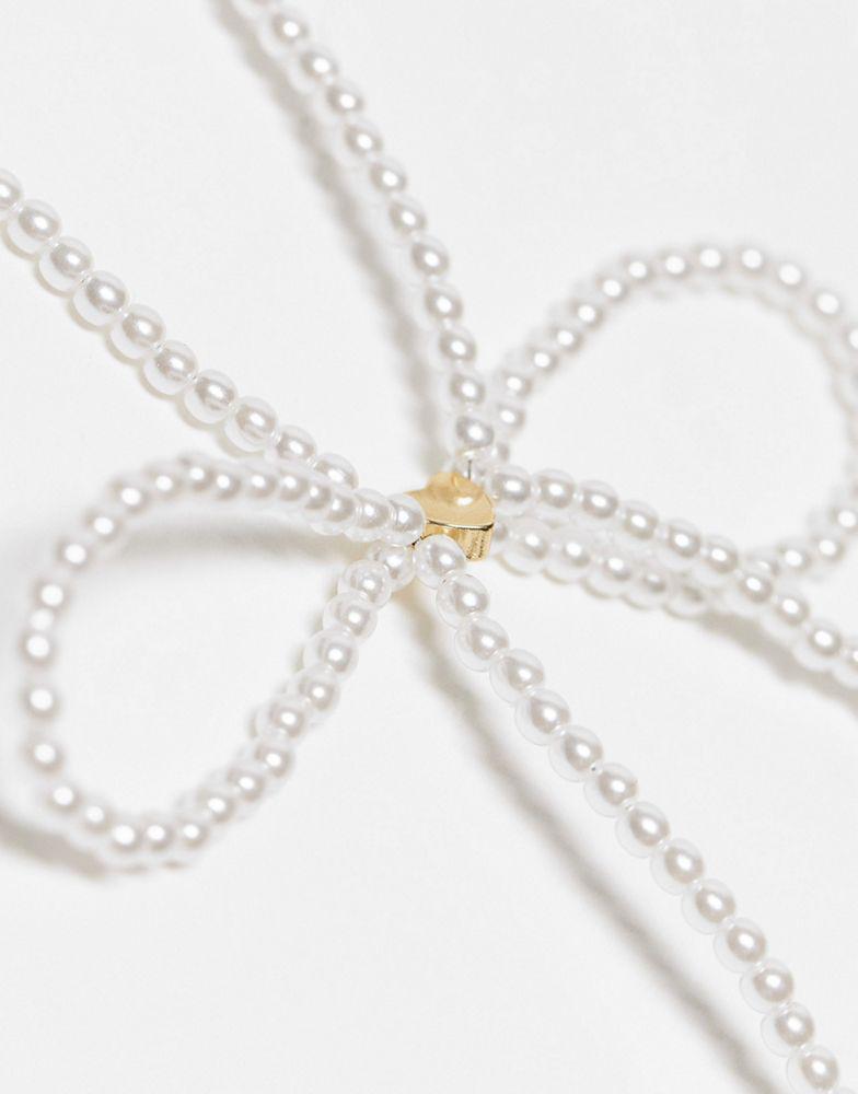 商品Reclaimed Vintage|Reclaimed Vintage skinny pearl bow necklace,价格¥83,第4张图片详细描述