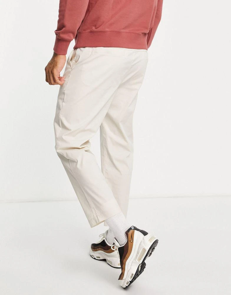 商品NIKE|Nike Sport Essentials cropped woven straight leg sneaker pants in stone,价格¥312,第2张图片详细描述