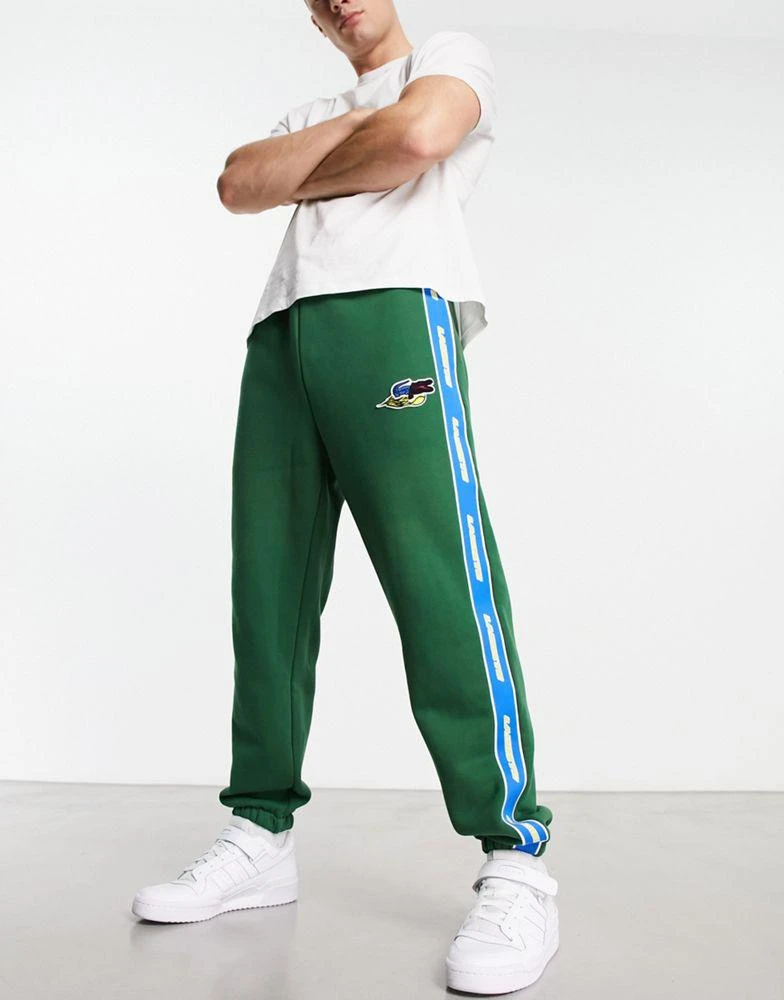 商品Lacoste|Lacoste Holiday large logo joggers in white,价格¥701,第1张图片