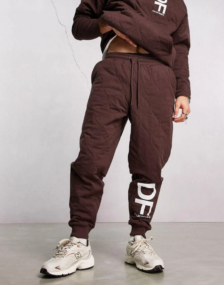 商品ASOS|ASOS Dark Future co-ord relaxed joggers with onion quilting and logo print in brown,价格¥167,第4张图片详细描述