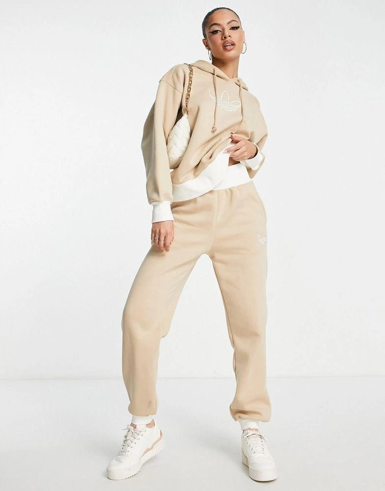 商品Adidas|adidas Originals Mountain Explorer contrast cuffed joggers in beige,价格¥475,第1张图片