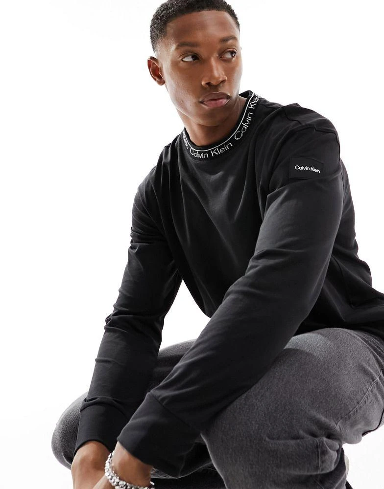 商品Calvin Klein|Calvin Klein unisex running logo long sleeve t-shirt in black,价格¥483,第1张图片