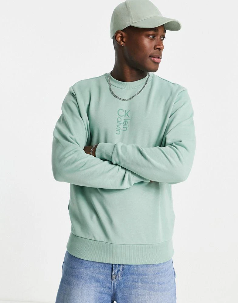 商品Calvin Klein|Calvin Klein hybrid logo sweatshirt in teal green,价格¥439,第1张图片