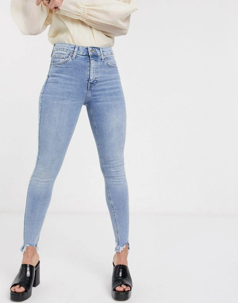 商品Topshop|Topshop Jamie jeans with jagged hem detaling in bleach wash,价格¥224,第1张图片