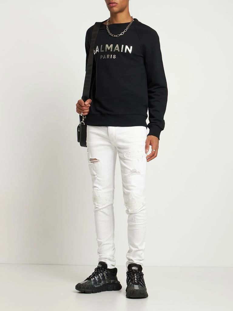 商品AMIRI|Mx1 Leather Patch Stretch Denim Jeans,价格¥8388,第1张图片详细描述