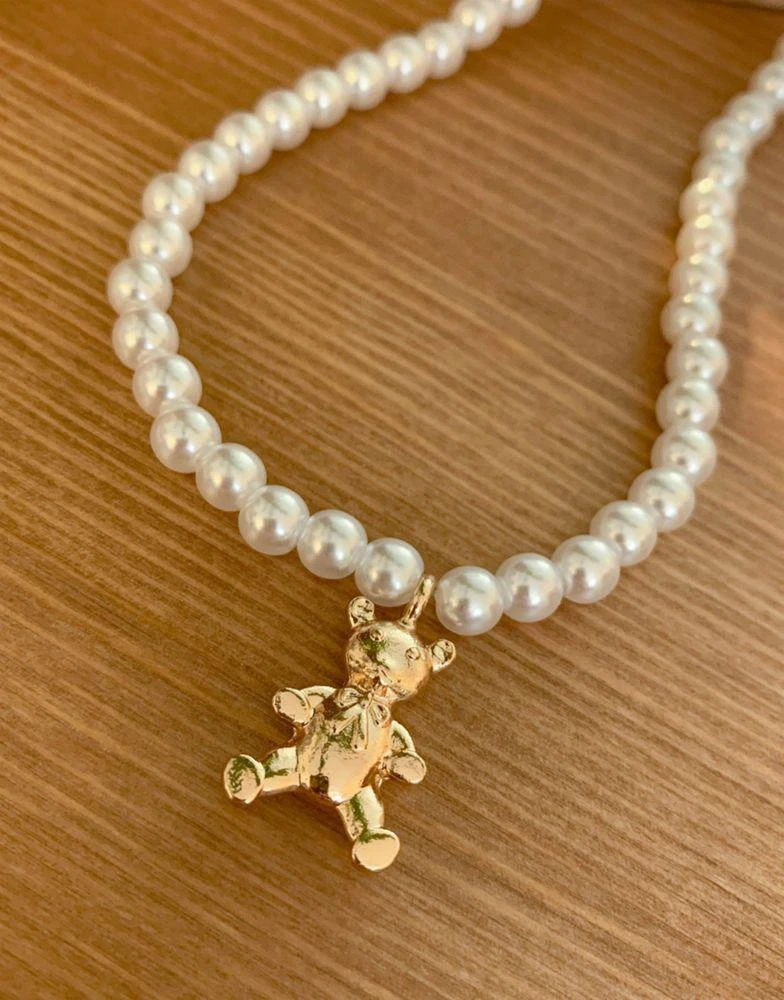 商品ASOS|ASOS DESIGN necklace with pearl and teddy bear charm in gold tone,价格¥44,第2张图片详细描述
