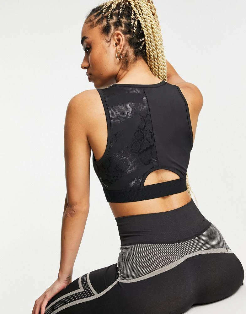 商品Puma|Puma train black print crop top in black,价格¥84,第2张图片详细描述