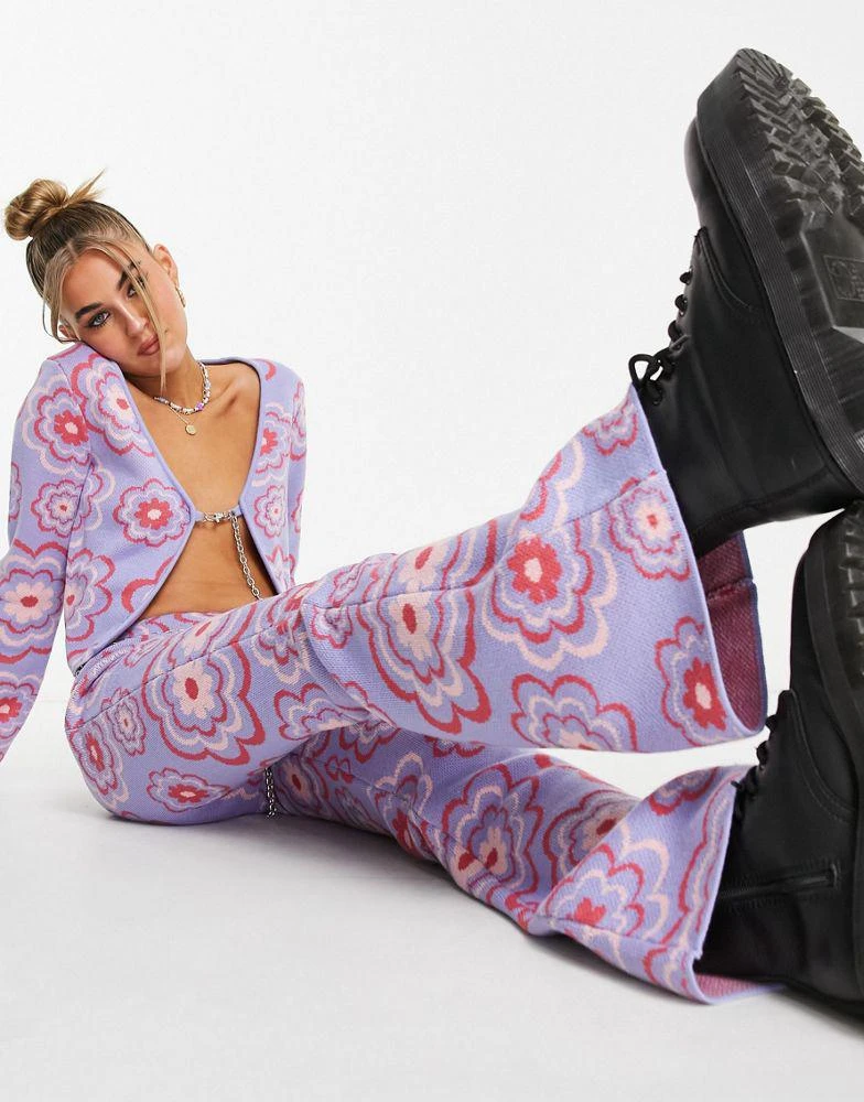 商品The Ragged Priest|The Ragged Priest knitted flare trousers with chain belt in retro floral co-ord,价格¥353,第1张图片