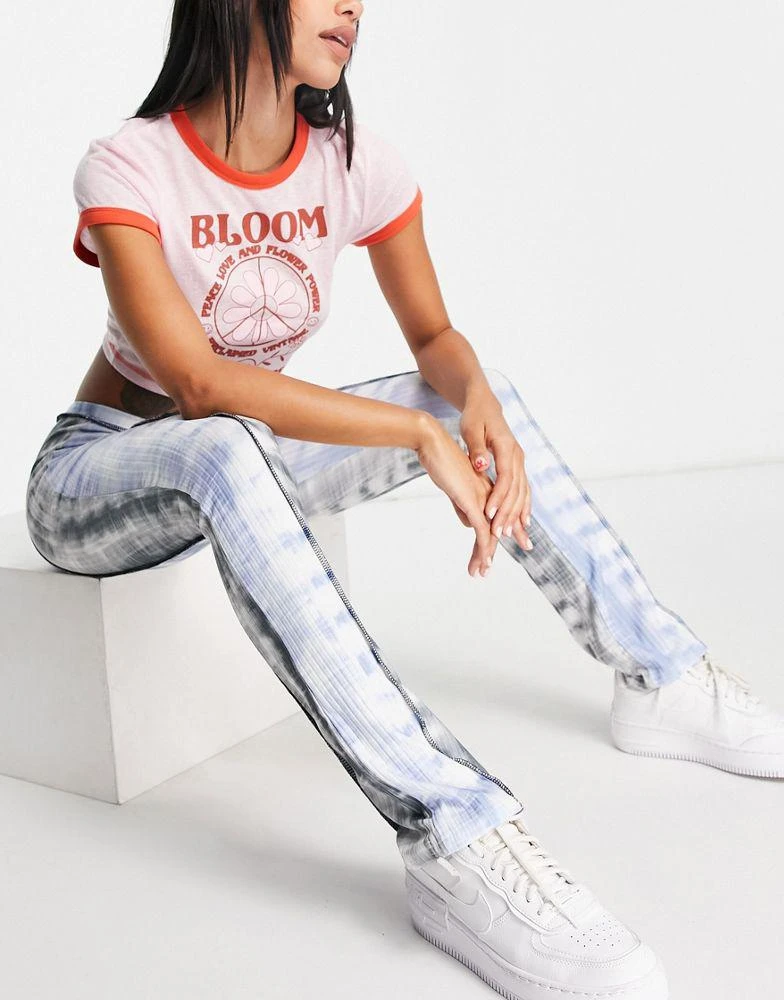 商品ASOS|ASOS DESIGN rib flare trouser with exposed seam in cut about tie dye print,价格¥82,第1张图片