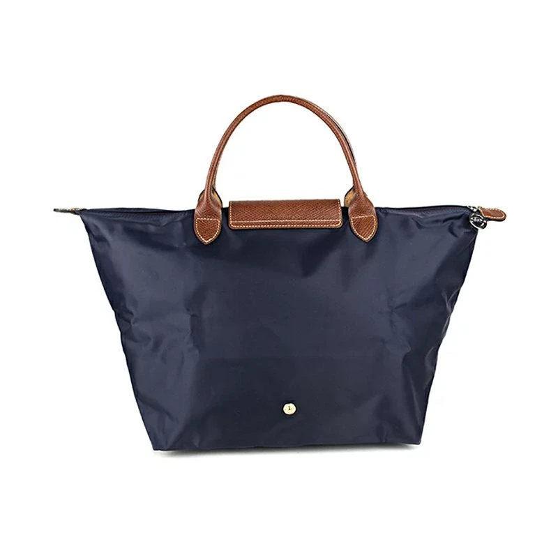 商品[国内直发] Longchamp|珑骧 LONGCHAMP 奢侈品 女士LE PLIAGE系列中号藏蓝色尼龙短柄可折叠手提包饺子包 1623 089 556,价格¥478,第2张图片详细描述