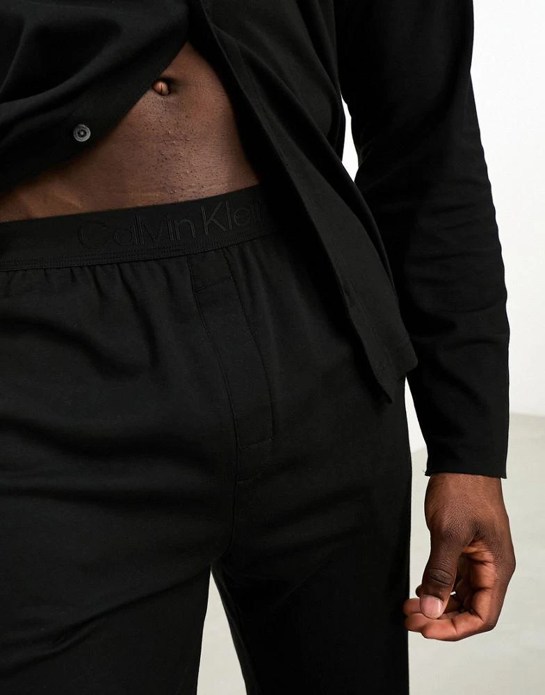 商品Calvin Klein|Calvin Klein CK Black button down sleep shirt and trouser pyjama set  in black,价格¥1265,第2张图片详细描述