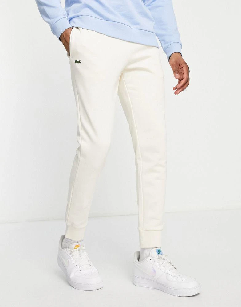 商品Lacoste|Lacoste fleece joggers in off white,价格¥494,第3张图片详细描述