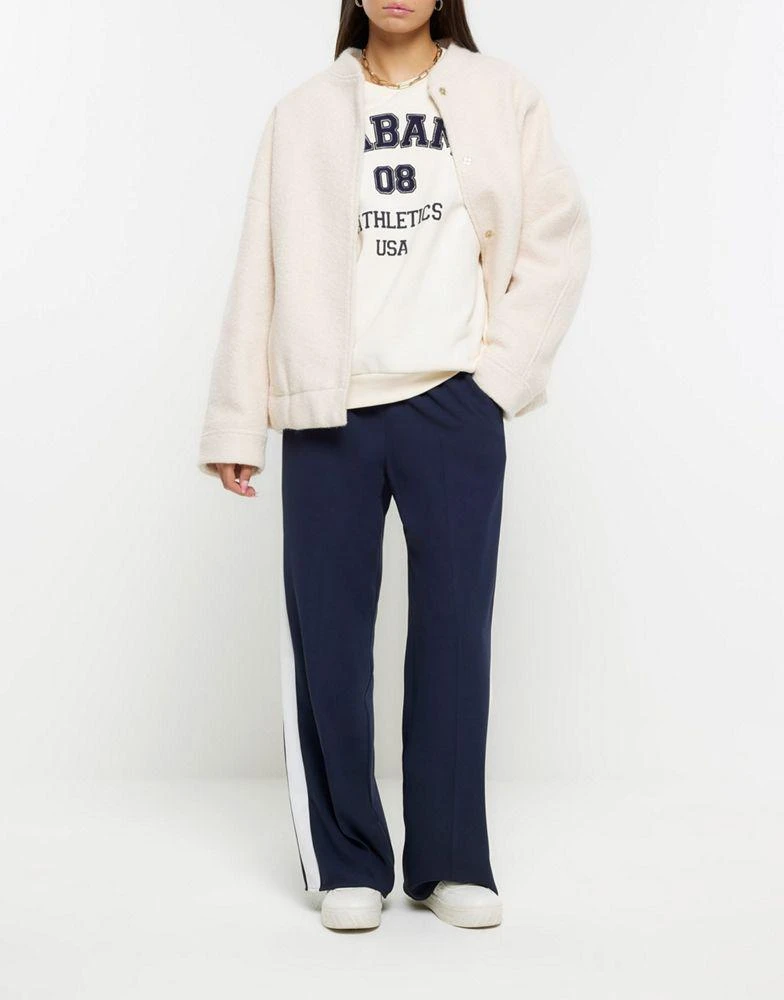 商品River Island|River Island Side stripe wide leg joggers in navy,价格¥438,第1张图片