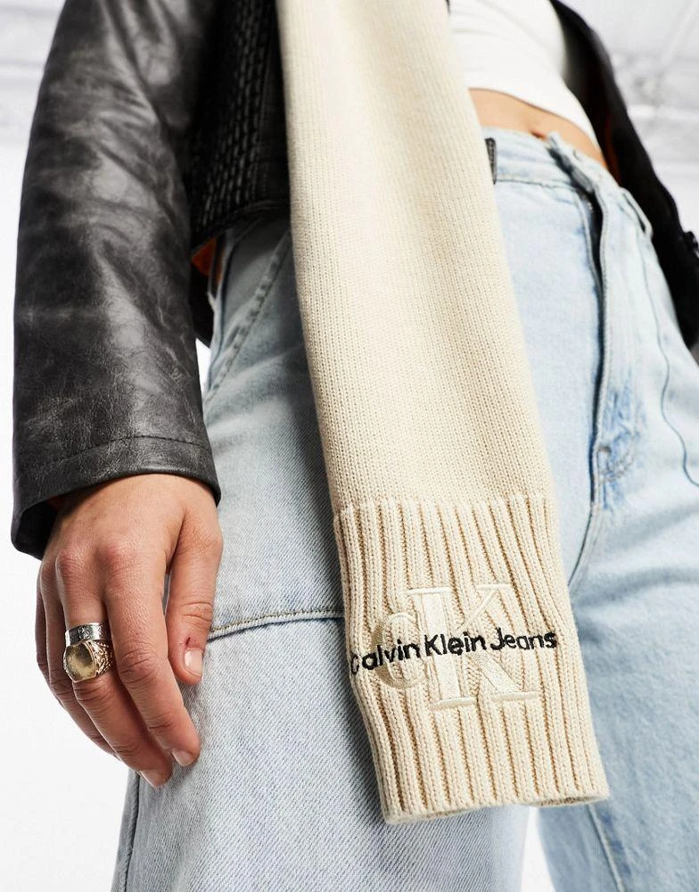 商品Calvin Klein|Calvin Klein Jeans monogram logo embroidered knit scarf in ivory,价格¥242,第3张图片详细描述