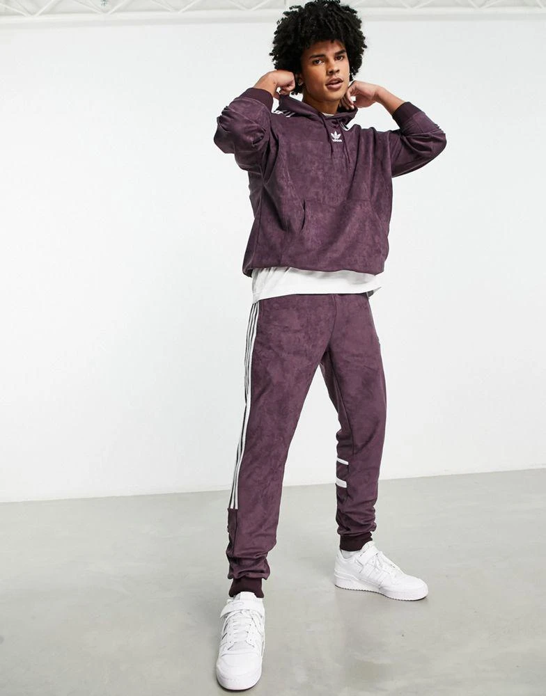 商品Adidas|adidas Originals Adicolor polyester blend three stripe joggers in maroon,价格¥511,第1张图片