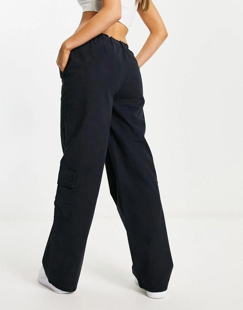 商品ASOS|ASOS DESIGN oversized cargo trouser with multi pocket and tie waist in black,价格¥181,第2张图片详细描述