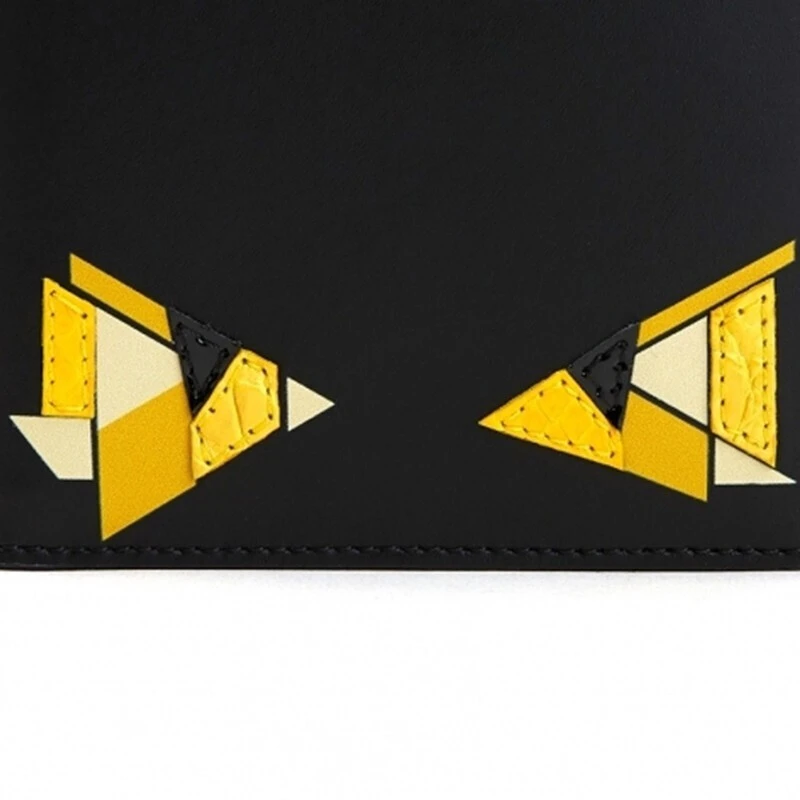商品Fendi|FENDI 男士黑色皮革黄色小怪兽眼睛短款折叠钱夹 7M0169-AATY-F0R2A,价格¥3032,第1张图片