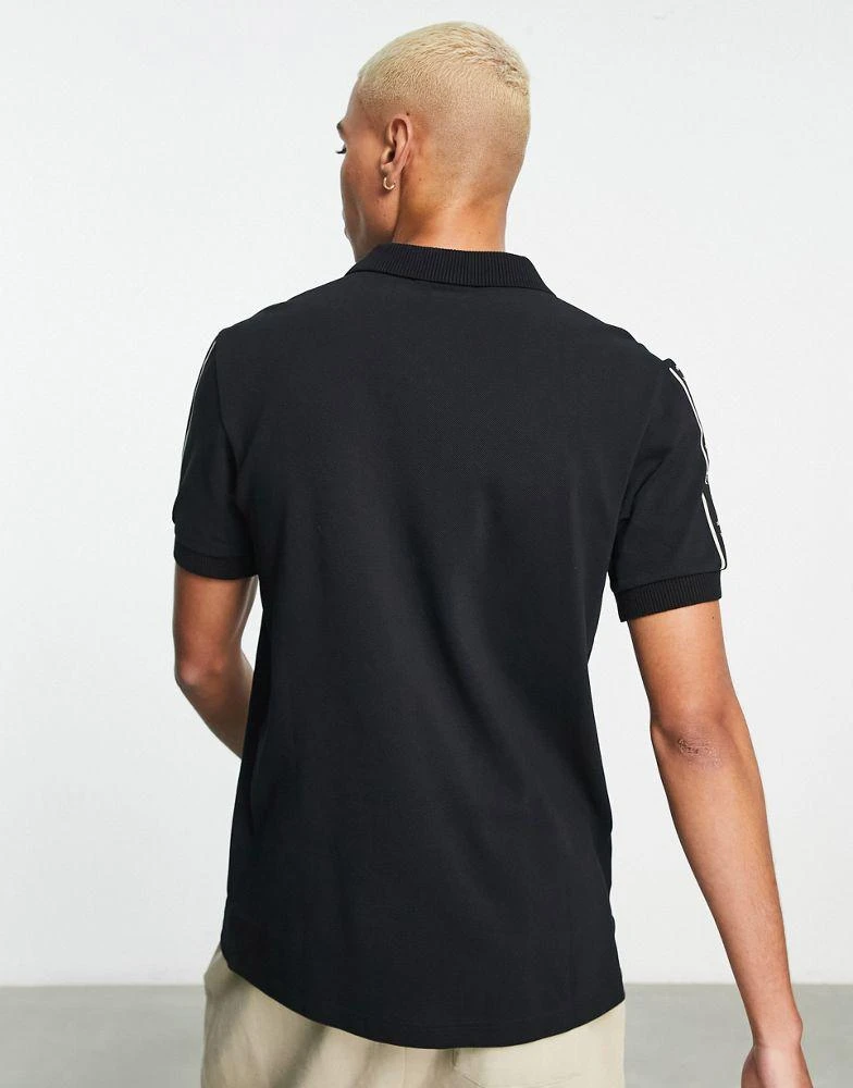 商品Fred Perry|Fred Perry taped sleeve polo shirt in black,价格¥721,第2张图片详细描述