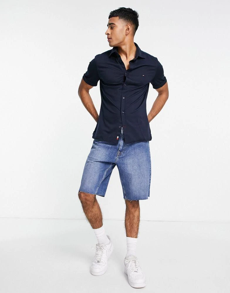 商品Tommy Hilfiger|Tommy Hilfiger 1985 icon logo short sleeve pique shirt slim fit in navy,价格¥700,第4张图片详细描述