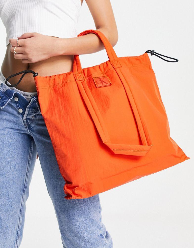商品Calvin Klein|Calvin Klein Jeans city nylon square tote bag in coral orange,价格¥869,第6张图片详细描述