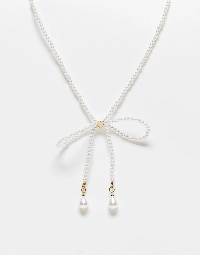 商品Reclaimed Vintage|Reclaimed Vintage skinny pearl bow necklace,价格¥108,第1张图片