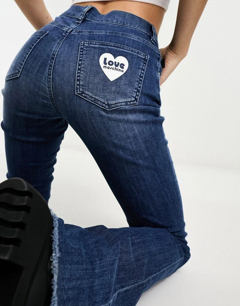 商品Love Moschino|Love Moschino flared high waist jeans in mid blue wash,价格¥581,第2张图片详细描述