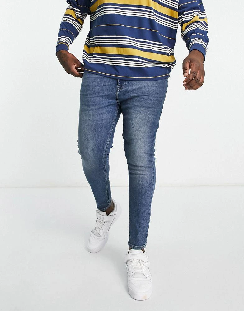 商品ASOS|ASOS DESIGN power stretch jeans in mid wash blue,价格¥174,第2张图片详细描述