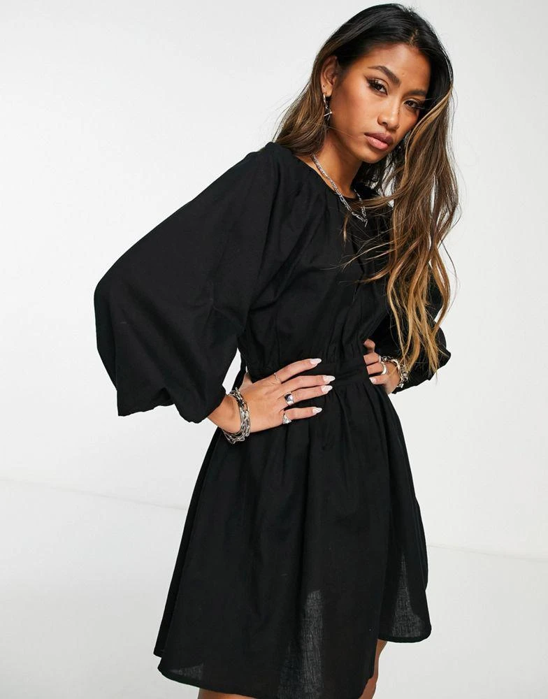 商品HYPE|Violet Romance puff sleeve tiered mini dress in black,价格¥119,第1张图片