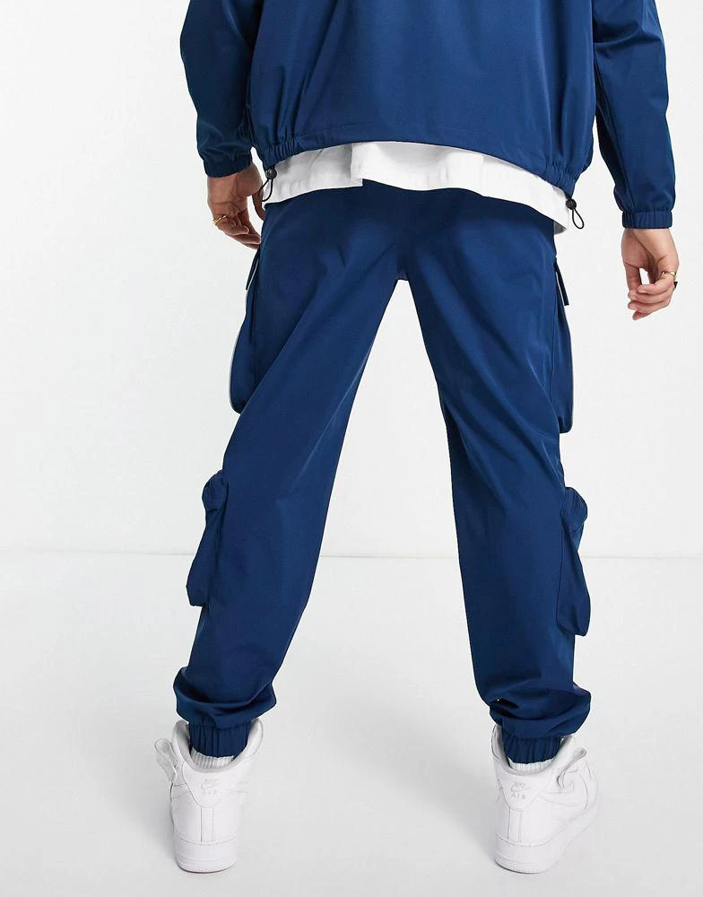 商品Topman|Topman relaxed nylon four pocket co-ord cargo trousers in blue,价格¥245,第2张图片详细描述