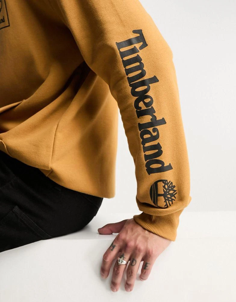 商品Timberland|Timberland stack logo hoodie with sleeve print in wheat,价格¥405,第4张图片详细描述