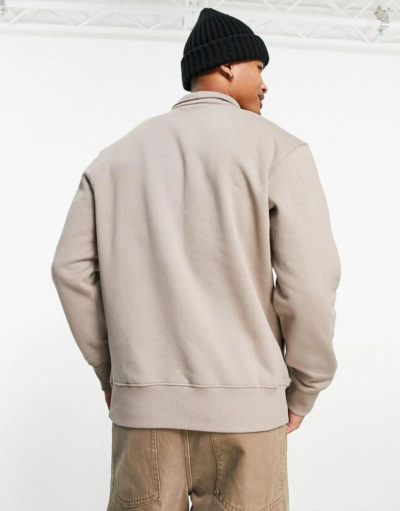 商品Calvin Klein|Calvin Klein Jeans monologo quarter zip rugby sweatshirt in taupe,价格¥573,第2张图片详细描述