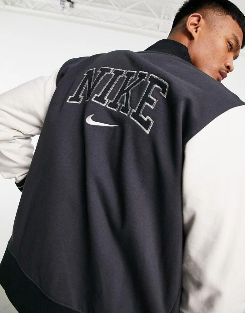 商品NIKE|Nike Retro Varsity fleece jacket in off white/washed black,价格¥692,第1张图片