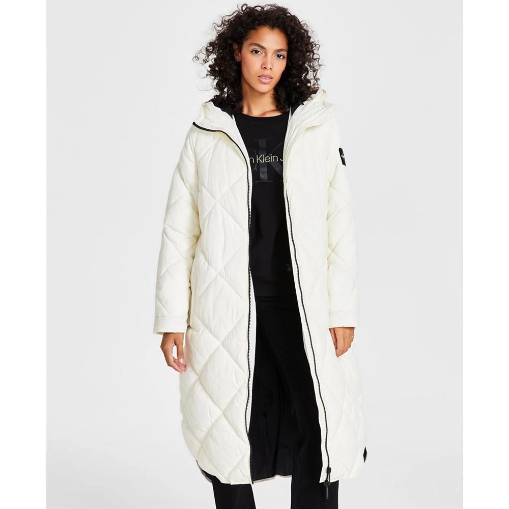 商品Calvin Klein|Women's Cire Drama Hooded Longline Puffer Jacket,价格¥1109,第1张图片