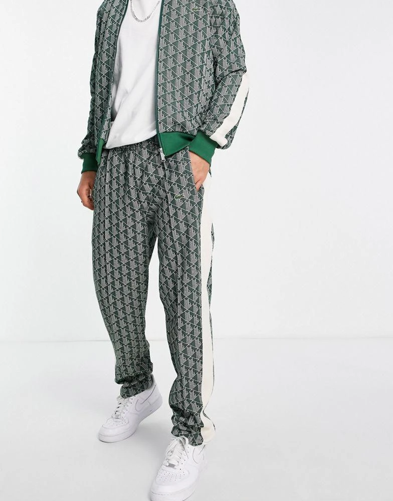 商品Lacoste|Lacoste all over print taped track bottoms in green,价格¥786,第4张图片详细描述