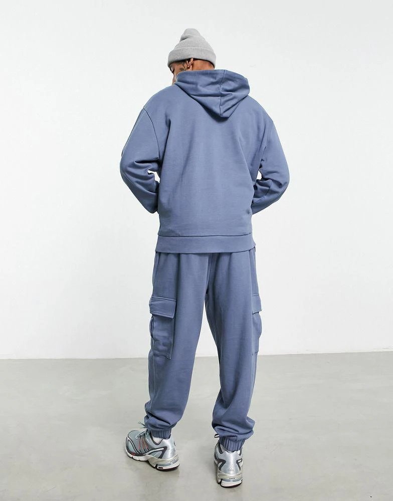 商品ASOS|ASOS DESIGN oversized hoodie and oversized joggers with cargo pocket tracksuit in blue,价格¥256,第2张图片详细描述