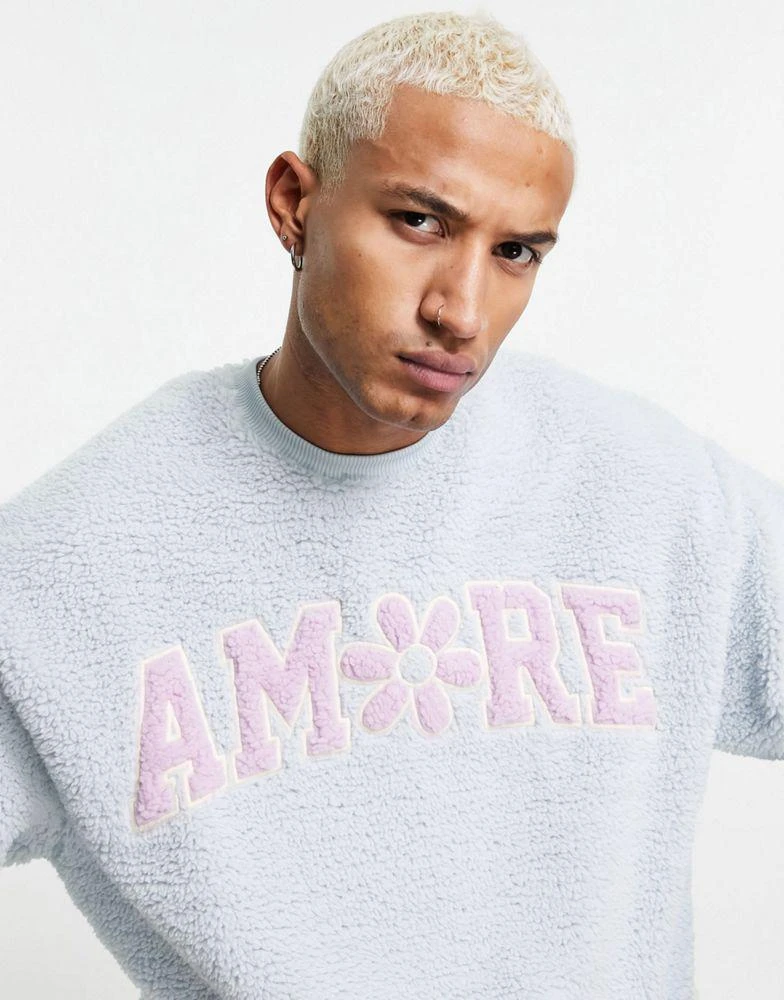 商品ASOS|ASOS DESIGN oversized sweatshirt with amore boucle print on chest,价格¥136,第1张图片