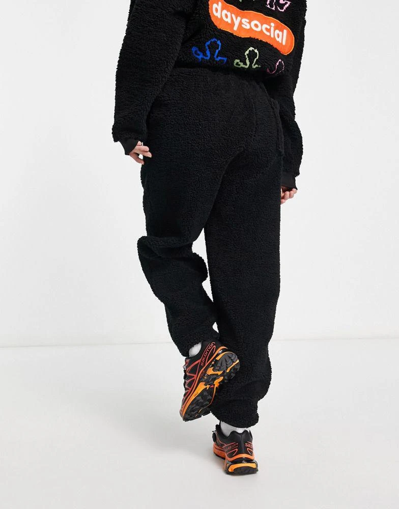 商品ASOS|ASOS Daysocial unisex co-ord relaxed joggers in teddy borg with back embroidery in black,价格¥337,第4张图片详细描述