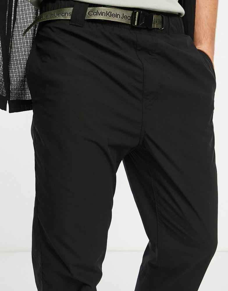 商品Calvin Klein|Calvin Klein Jeans utility tab belt loose woven trousers in black,价格¥565,第6张图片详细描述
